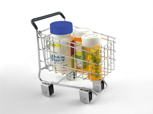 Pill bottles in a miniature shopping cart Medication Synchronization & Auto Fill